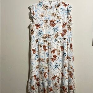 Floral knee length peasant dress. Ruffle neck and sleeve detail. Size M.